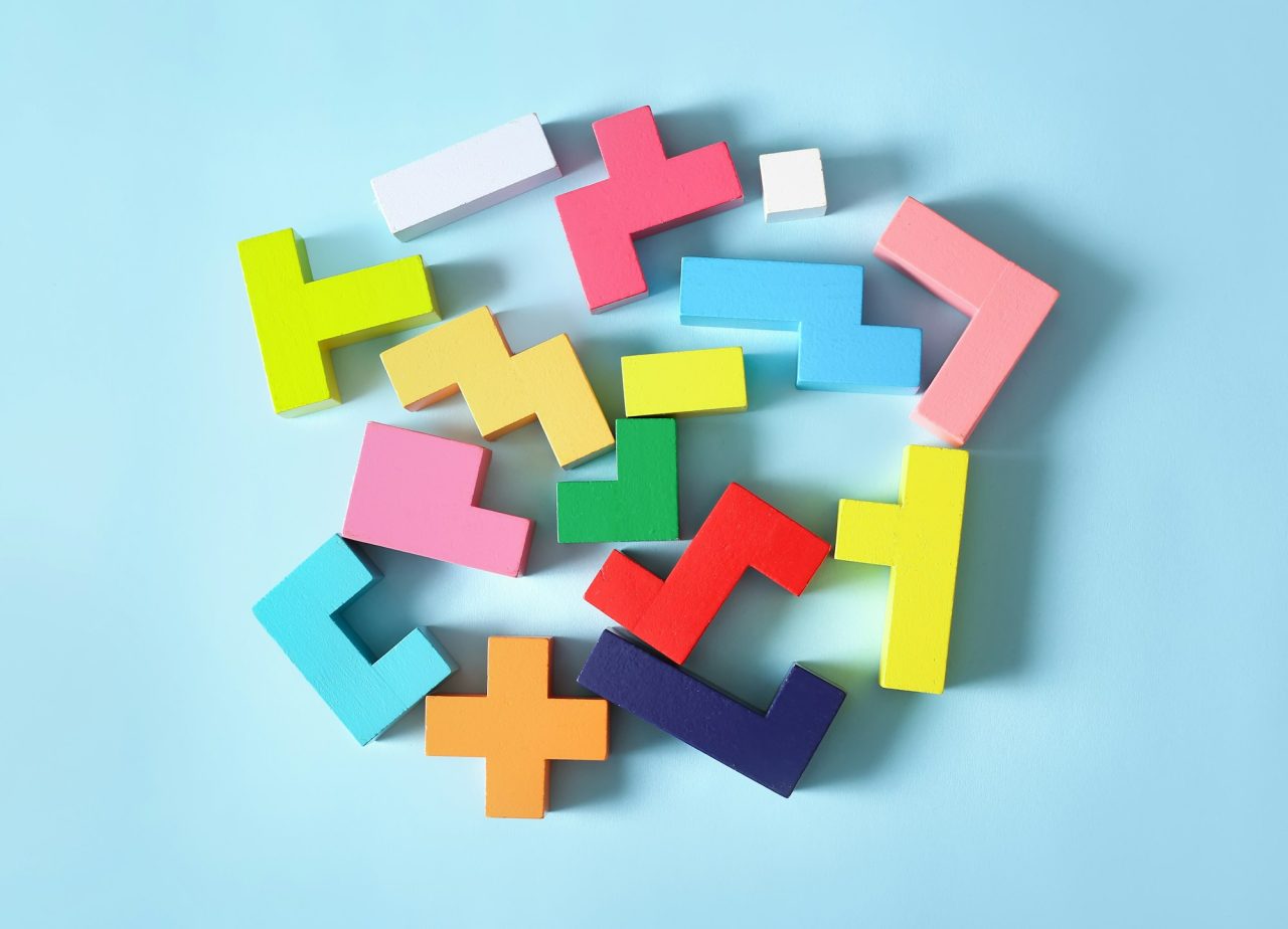 Multicolored puzzle, cubes on a blue background